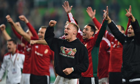 Captain Balazs Dzsudzsak, centre, of Hungary and his players celebrate their victory.