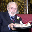 Spike Milligan with his honorary knighthood in 2001