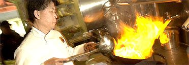 Celebrity chef Martin Yan cooking