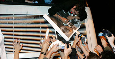 Pete Doherty signing autographs from the back of his tour bus in Bristol