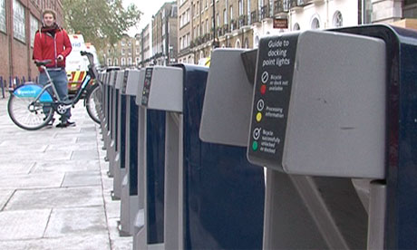 Cyclist at Barclay's Bike scheme docking station
