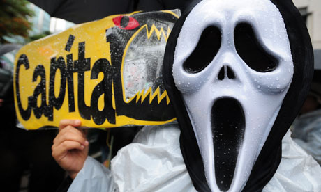 A South Korean protester holds a banner during the Occupy Seoul rally