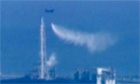 Japanese helicopters drop water on nuclear reactor - video