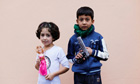 Refugee children pose during the first day of Eid al-Adha at Yayladagi refugee camp