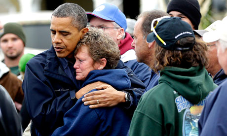 Barack Obama embraces woman during Sandy tour