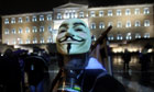 A protester wearing a Guy Fawkes mask in front of the Greek parliament, Athens