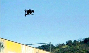 Teen skateboarder performing 1080