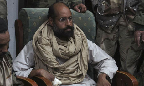 Saif Gaddafi in the custody of rebel fighters after his capture in November 2011