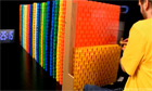 Domino dancing: enthusiast stacks 60,000 bricks and knocks them down – video