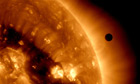 Venus transits across the sun