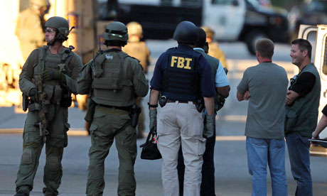 Police and FBI outside the shooter's home in Cudahy, Wisconsin
