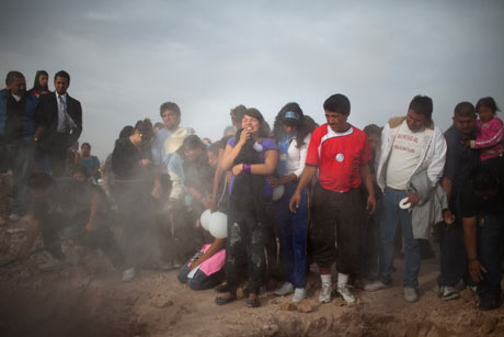 Friends and family mourn at the funeral of two sisters in Ciudad Juárez