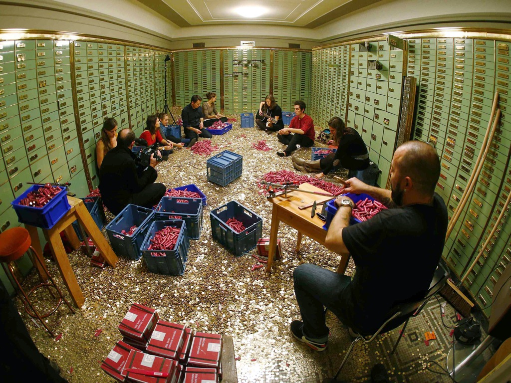 Members of 'Grundeinkommen' in the old vault of the former Schweizerische Volksbank in Basel