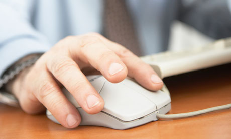 Businessman using a computer mouse
