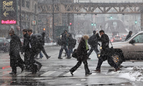 Commuters brave the elements on their way to work.