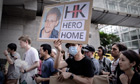 A protester with a photograph of Edward Snowden at the protest in Hong Kong