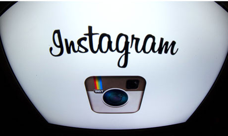 The Instagram logo is displayed on a tablet