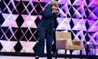 Hillary Clinton ducks to avoid a shoe thrown at her