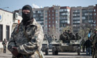 Man stands near tank in Slavyansk, Ukraine