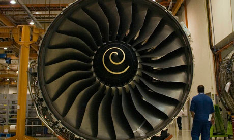 An engineer walks by a RollsRoyce engine for the A380 at the Singapore Aero