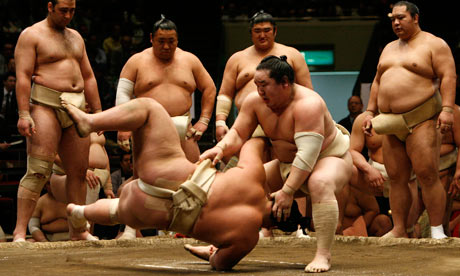 Asashoryu throws and opponent during a sumo bout in Tokyo