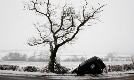 A Range Rover lies in a ditch