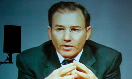 Glencore chief Ivan Glasenberg broadcast on tele-conference screen