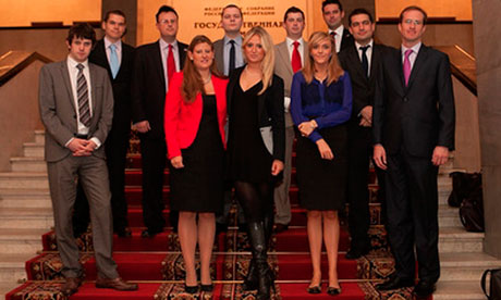 Members of the Conservative Friends of Russia pose on the staircase of Russia's Duma