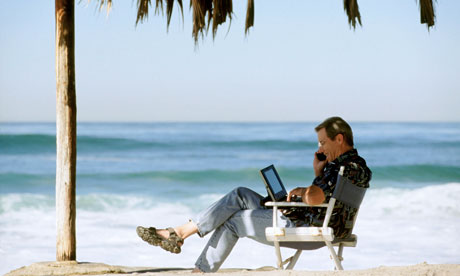 Using mobile Phone and Laptop on Tropical Beach