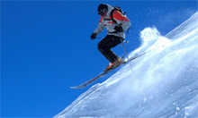 PV-Holidays.com. Man skis downhill - book now to save up to 20%