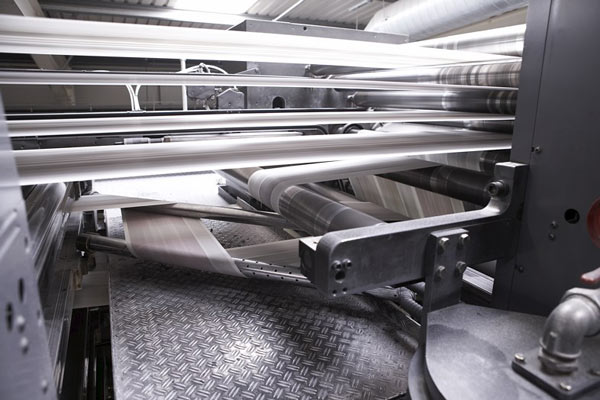 Roller array aligns the newsprint webs