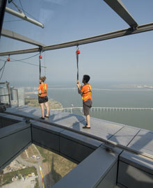 Tourists enjoy walking around the outside of the Macau Tower