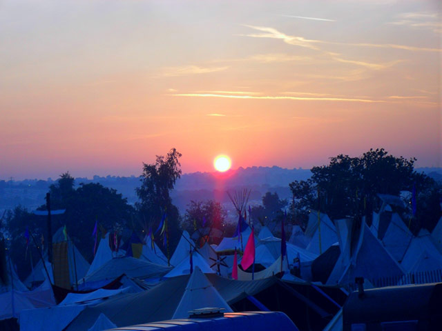 Sunrise over a sea of festival tents