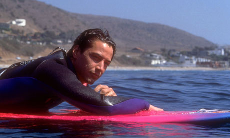 Keanu Reeves surfing in the film Point Break