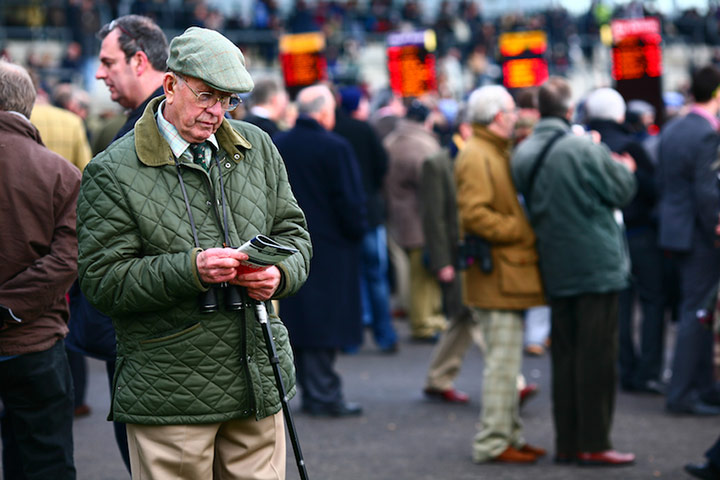 Enjoy England Newbury: A dapper gentleman checks the runners and riders in the betting ring