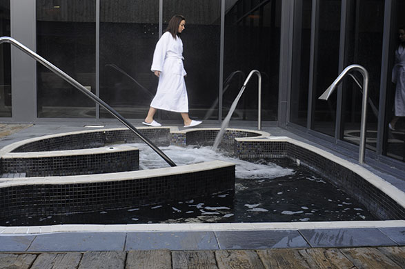 Bluestone: A woman in a dressing gown explores Bluestone's spa