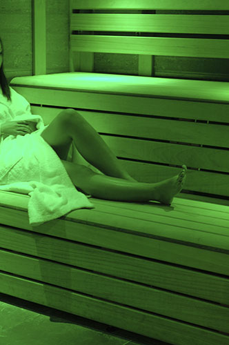 Bluestone: A woman enjoying a sauna
