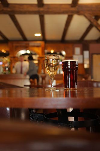 Bluestone: Close up of a glass of wine and a pint of beer at Bluestone