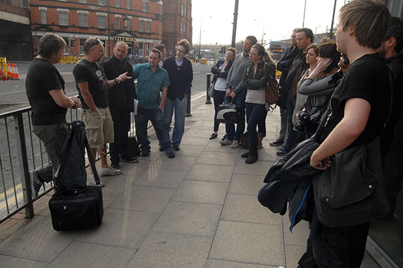   Manchester Music Tour: Peter Hook (second from left) talks to the tour at the Hacienda nightclub