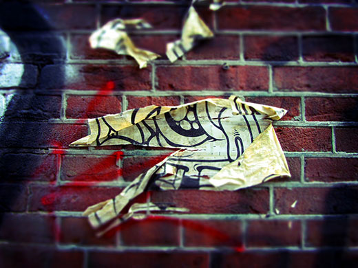 Abstract: A flyer on a brick wall