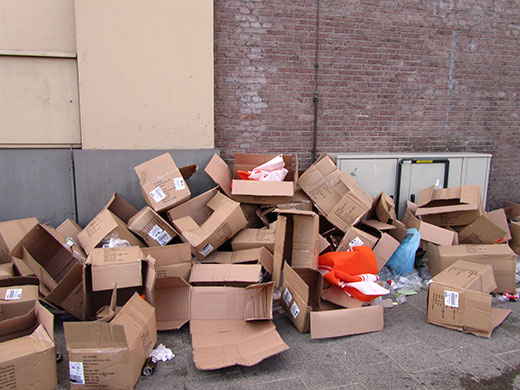 Abstract: Cardboard boxes outside a warehouse