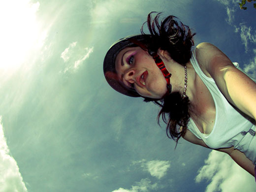 Movement: A girl shot from below against a blue sky