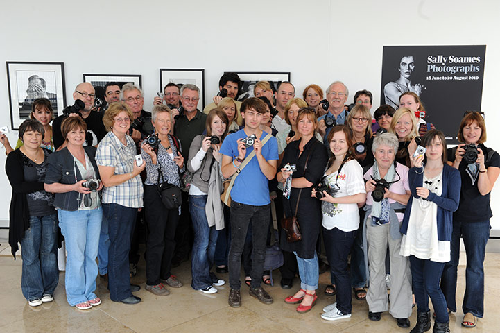 King's Cross : The lucky winners with their cameras at The Guardian, Kings Place.