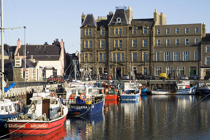 Visit Orkney: Fishing boats berth in the harbour of Orkney's capital Kirkwall