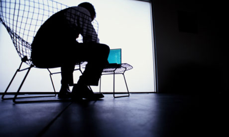 Young man on wireframed chair using laptop computer silhouette