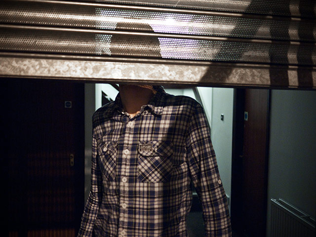 Panasonic East London: Shutters obscuring a man's face