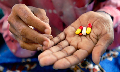 29-year-old Poeun Pech, an HIV positive mother of two boys, holds her cocktail of ARVs at a hospital