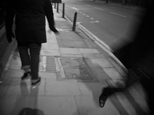 Panasonic - Nocturnal: People walking past each other on a London street at night