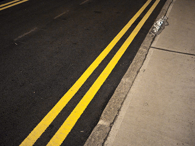 Panasonic - Nocturnal: Double yellow lines on a road in London
