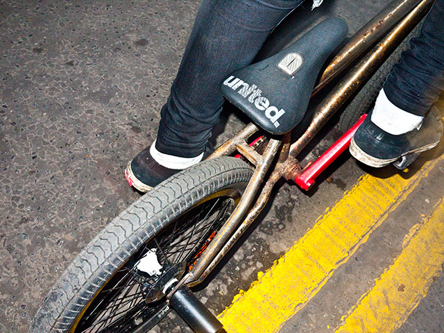 Panasonic rooftop rider: A bike parked by double yellow lines